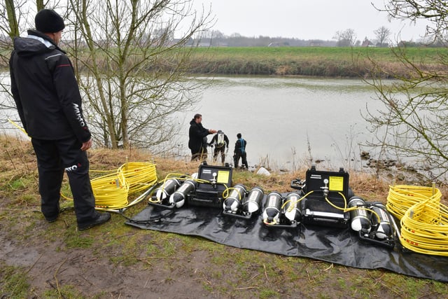 The police underwater search team's equipment laid out on the bank of the River Witham. EMN-220203-143030001