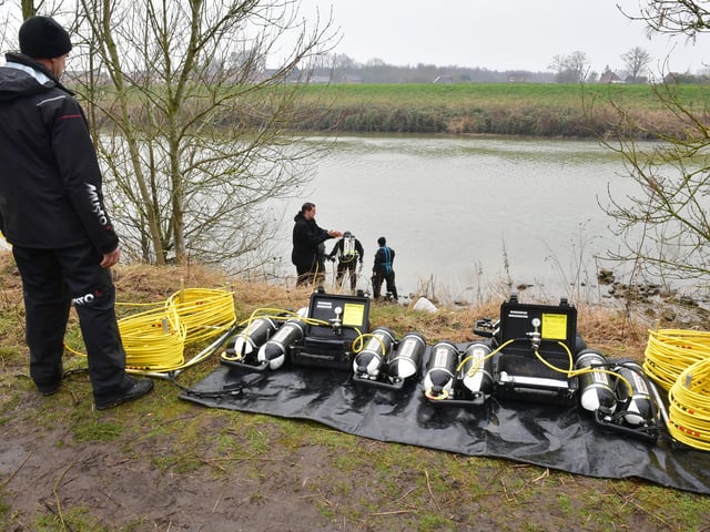 The police underwater search team's equipment laid out on the bank of the River Witham. EMN-220203-143030001