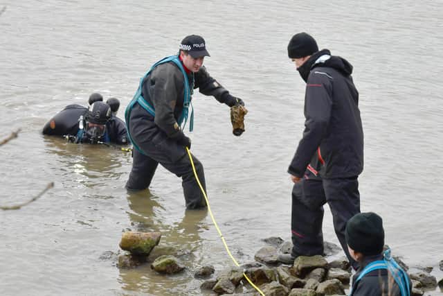 Police underwater search team, searching the River Witham in Boston. This item police are handling was believed to be 'of no interest'.  Photos by David Dawson.