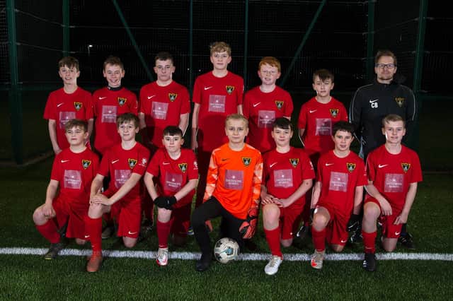 Harborough Town FC Under-13s are putting on the style in their new red strips after receiving a £500 donation from Davidsons Homes.