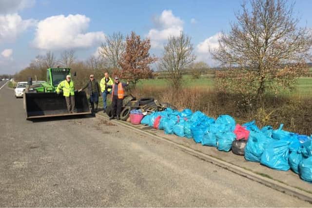 Almost three dozen public-spirited volunteers have picked up nearly 100 bags of rubbish dumped along the A6 Market Harborough bypass.