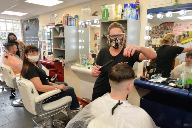 Michelle Weston of Snippers Barbers cutting over 100 hair cuts today.
PICTURE: ANDREW CARPENTER