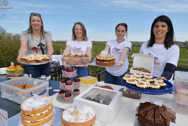 Anyone for cake? Helen Freeman, Hannah Burrows, Charlotte Smith and Rena Gadhia during the Stand Up For Cancer event on Berry Close in Great Bowden.
PICTURE: ANDREW CARPENTER