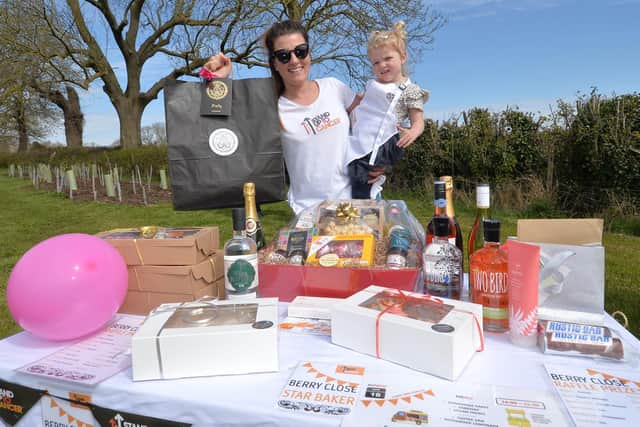 Raffle prizes galore...Laura Brookes with daughter Sophia aged three.
PICTURE: ANDREW CARPENTER