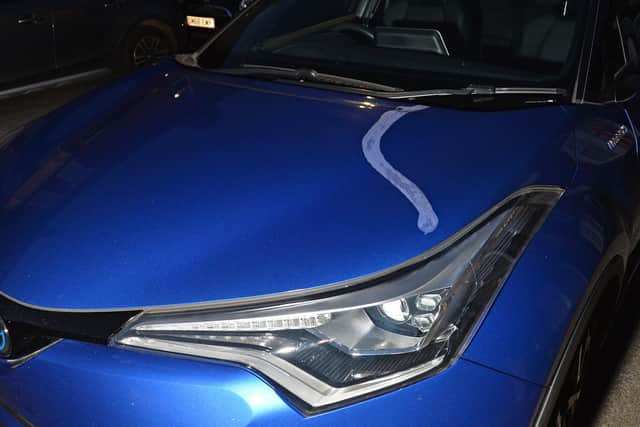 Vehicles daubed with paint stripper on Caxton Street during late Saturday evening.
PICTURE: ANDREW CARPENTER
