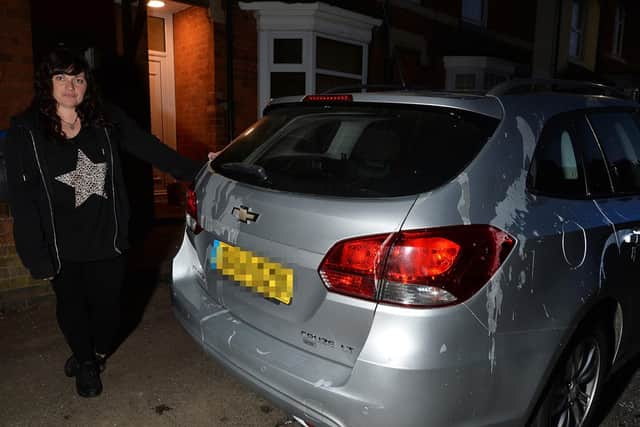 Angry...Amy Bradshaw with her vandalised car after the attack on Caxton Street on Saturday evening.
PICTURE: ANDREW CARPENTER
