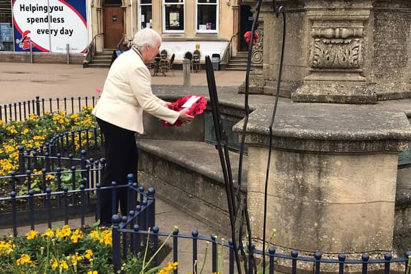 Market Harborough Royal British Legion president Barbara Johnson lays a wreath to celebrate a 100 years.