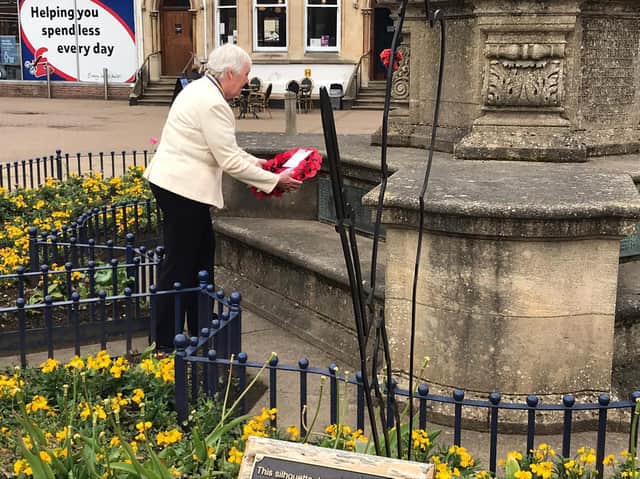 Market Harborough Royal British Legion president Barbara Johnson lays a wreath to celebrate a 100 years.