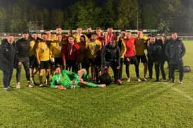 The Harborough Town players and staff celebrate after they beat ON Chenecks 2-0 in the final of the United Counties League’s supplementary competition on Tuesday night. Picture courtesy of Harborough Town FC