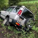 Police were called out after this Land Rover Discovery ended up in a ditch on a country road near a Harborough village.