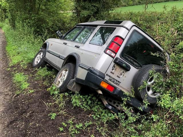 Police were called out after this Land Rover Discovery ended up in a ditch on a country road near a Harborough village.