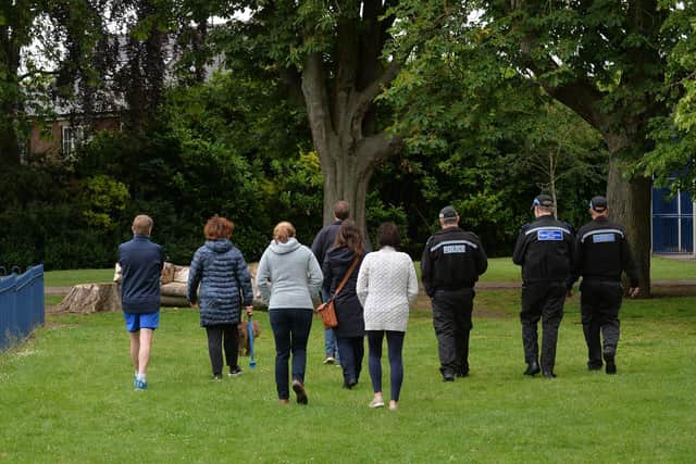 Police and concerned residents visit some of the hot spots at Little Bowden recreation ground.
PICTURE: ANDREW CARPENTER