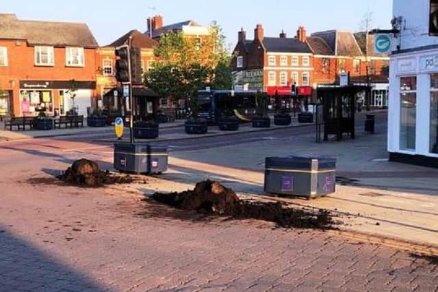 Vandals have wrecked stunning floral displays and left a trail of damage in Market Harborough town centre last night (Tuesday).
