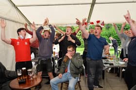 Fans celebrate England's victory against Germany at the Royalist in Market Harborough.
