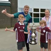 Adam Cruickshank (PE teacher) and Sarah Hubbard (finance) with Lucas and Henry Williams who were at Wembley.
PICTURE: ANDREW CARPENTER