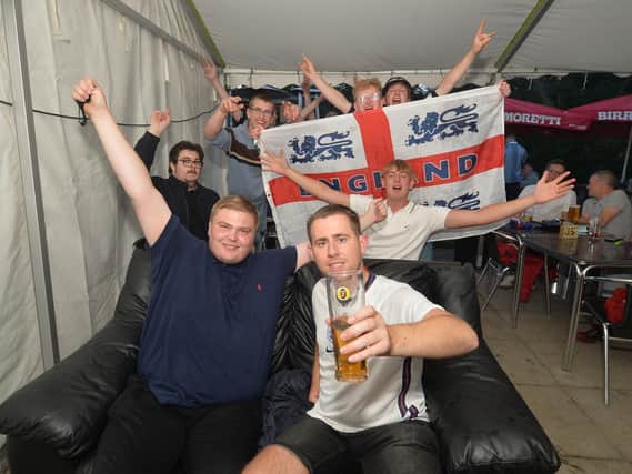 Fans celebrate England's 4-0 victory at the Royalist pub on Western Avenue in Market Harborough.