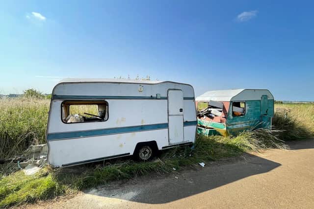 Two gutted caravans have been loaded up with rubbish and dumped by a busy road near Market Harborough.