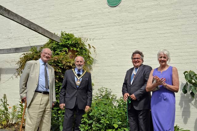 John Tillotson (Market Harborough Civic Society), Dan Harrison (Leicestershire County Council chairman), Vice Lord Lieutenant Lars Tharp and Jack Gardner's daughter Jackalyn Bradford-Turner unveil the green plaque in the memorial gardens at Market Harborough.