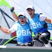Dylan Fletcher (right) and Stuart Bithell  celebrate winning gold in the Men's Skiff 49er class medal race in Tokyo. Picture by Phil Walter/Getty Images