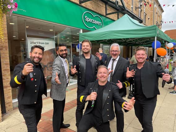 Charity boost....Take@That members Mark Smith, Gavin Pearson, Dean Barrett (Front), and Ben Murphy with Punit Mistry senior optometrist who is climbing Kilimanjaro for MNH and Barry Henning store manager outside Specsavers in St Mary's Place on Saturday.
PICTURE: ANDREW CARPENTER