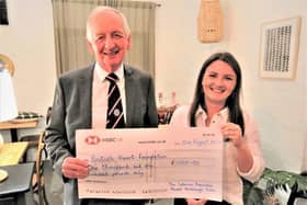 Bill Kerr, president of Market Harborough Catenians, presents the cheque to Hannah Pennock, the British Heart Foundation's area manager.
