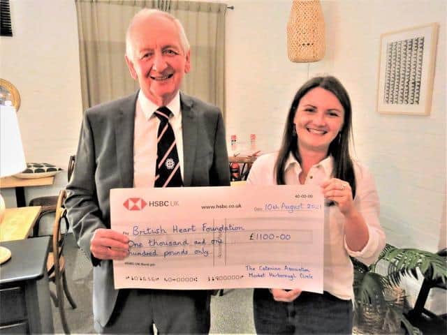 Bill Kerr, president of Market Harborough Catenians, presents the cheque to Hannah Pennock, the British Heart Foundation's area manager.