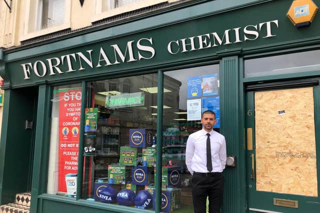 Kris Vyas, the manager at Fortnams Chemist, outside his store.