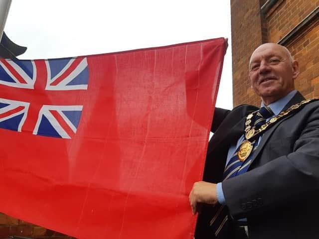 Council chairman Cllr Stephen Bilbie flying the flag
