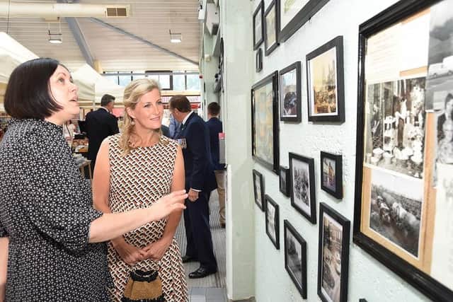 HRH Countess of Wessex with Sairah Butt, Harborough Market Manager, looking at the People's Gallery