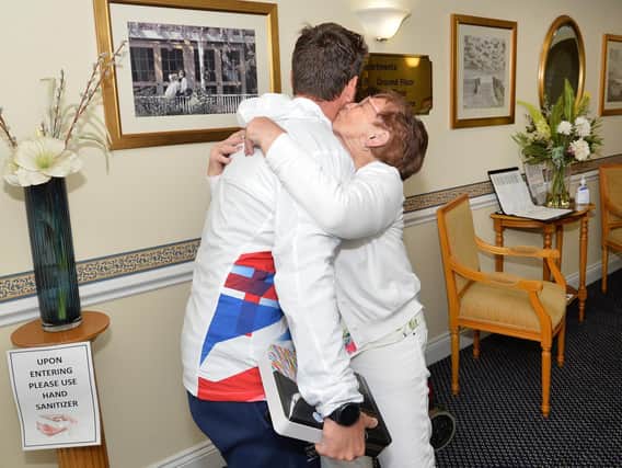 A hug for a hero: Olympic Gold Medal-winning sailor Dylan Fletcher returned home to Market Harborough for the first time since his heroics in Tokyo in August and visited his grandmother Hannah Scott at Pegasus Court.