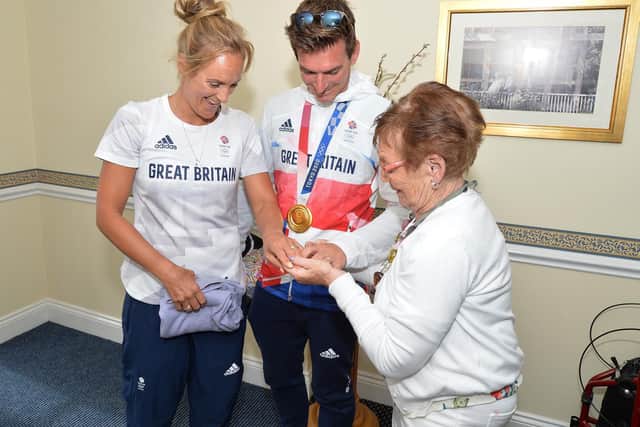 Olympic Gold Medal-winning sailor Dylan Fletcher returned home to Market Harborough for the first time since his heroics in Tokyo in August and visited his grandmother Hannah Scott at Pegasus Court. His new bride Charlotte Dobson, also a brilliant Olympic sailor, joined him for the visit.