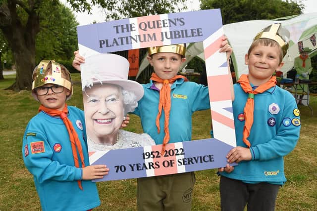 In the frame...Finlay Colquhoun, 5, Oscar Reed, 7, and Jake Nye, 6, of 3rd Market Harborough Beavers during the picnic to celebrate the Queen's Platinum Jubilee.
PICTURE: ANDREW CARPENTER