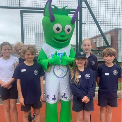 Great Bowden Academy pupils with School Games Mark Mascot Spike.