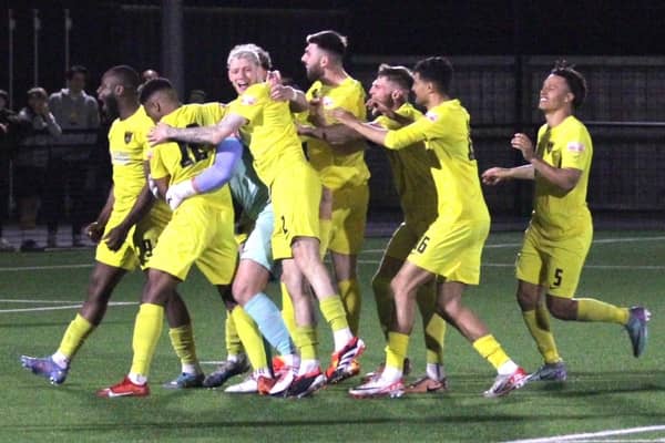 Harborough Town's players celebrate their penalty shoot-out win over Hinckley LRFC (Picture: Phil Passingham)