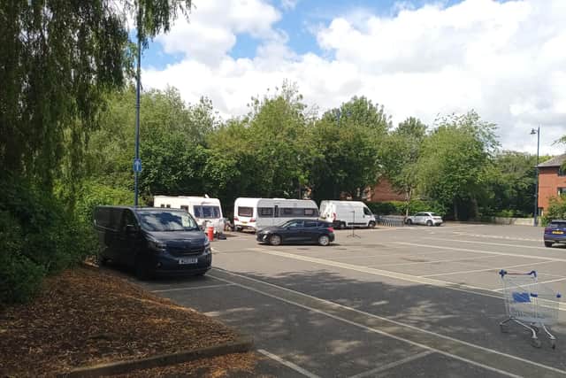 A group of travellers have pitched up on a busy shoppers’ car park in Market Harborough town centre today.