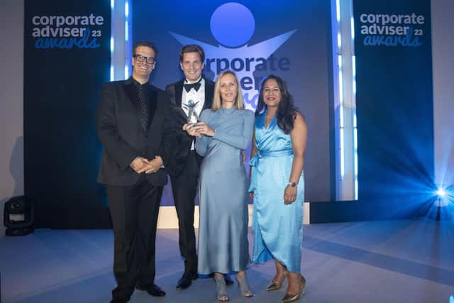 Marcus Brigstocke presents the award to William Johnson (Ink), Ruth Johnson (Ink) and Dipa Mistry Kandola (Cloud 8, Small Firm of the Year Award sponsor).