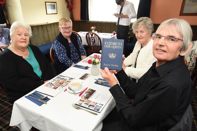 Sylvia Saunders, Pam Davison, Lynette Haines and Colin Sharp who was presented this book at school when he was eight. PICTURE: ANDREW CARPENTER