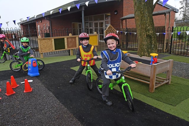 On yer bike! Pupils enjoy a spot of role play. 
PICTURE: ANDREW CARPENTER