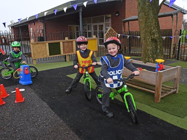 On yer bike! Pupils enjoy a spot of role play. 
PICTURE: ANDREW CARPENTER