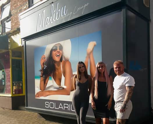 Malibu Tanning Lounge staff Jess Punter and Maia Bevan with owner James Cole