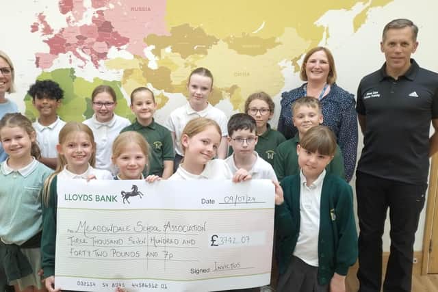 Simon raised over £3,700 for play and PE equipment at Meadowdale.