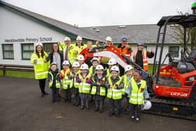 Members of the team from Davidsons Homes and DTC Construction with the Meadowdale Primary School stu
