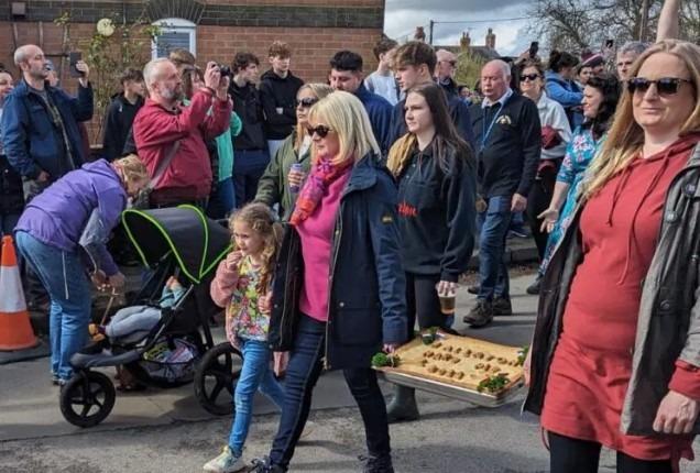 The customary hare pie was paraded before the crowds.