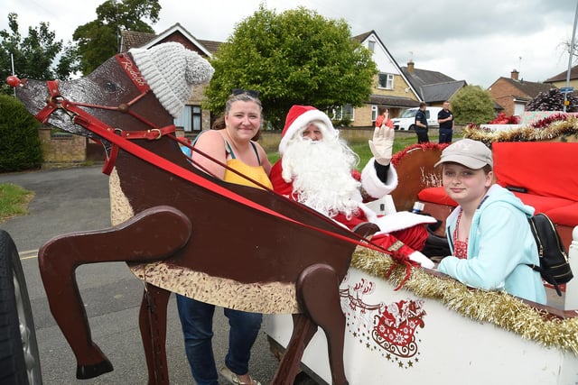 Santa Claus on the 3rd Market Harborough Scouts float with former 2001 carnival Queen Vanessa Scott and her daughter Darcie Mayell.
