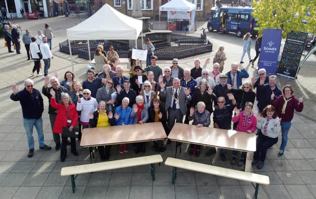 Centre, Chairman of Market Harborough District Council Neil Bannister with stall holders during the Volunteers Fair. Picture Andrew Carpenter