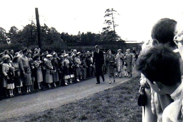 Her Majesty the Queen and Lt Col Harold Phillips make their way back from Church to Thorpe Lubenham Hall