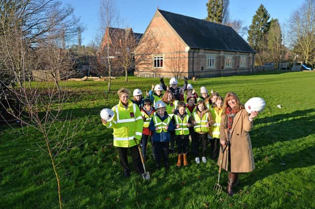 Sandy Baker, sales manager of Davidsons Homes (left), with Jo Cole, pond project co-ordinator (right), and pupils from Lubenham All Saints CE Primary School.