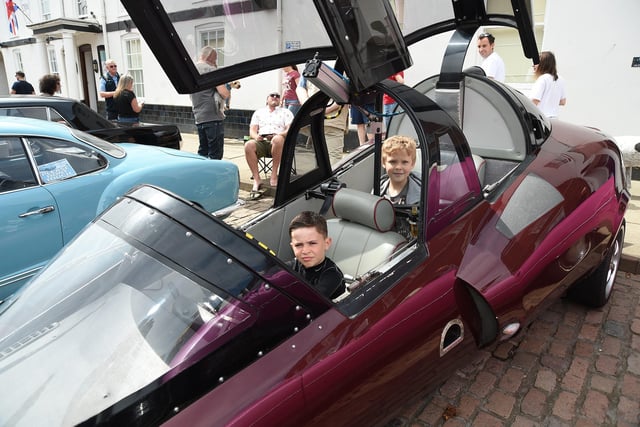 Lois Wolverson, 9, and Jan Kaczkowski, 8, sit inside a Phantom F4 built by Peter Gallop