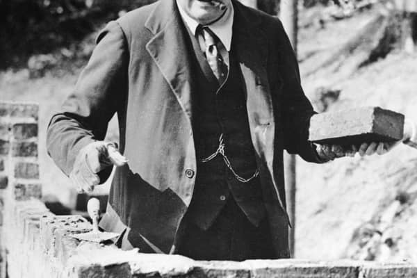 Winston Churchill carrying out some brick work at his home in Chartwell, Kent, in 1928 (photo: Getty Images)