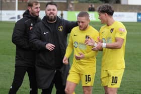 Mitch Austin congratulates goalscorer Jake Duffy at the end of the draw at Spalding on Saturday (Picture: Phil Passingham)
